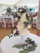 3 tier purple fresh flower buttercream wedding cake 